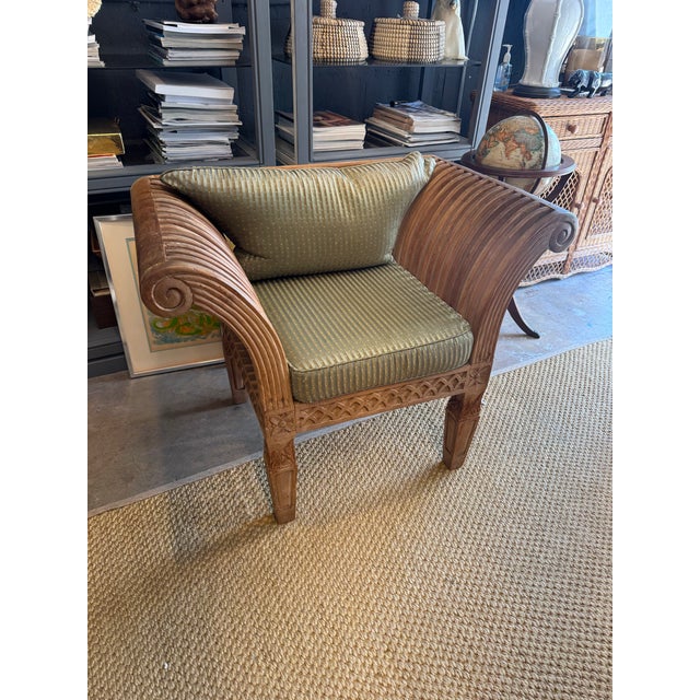 Sculptural, unique indoor and covered outdoor vintage 1970s hand carved solid teak chair. Original olive green striped...