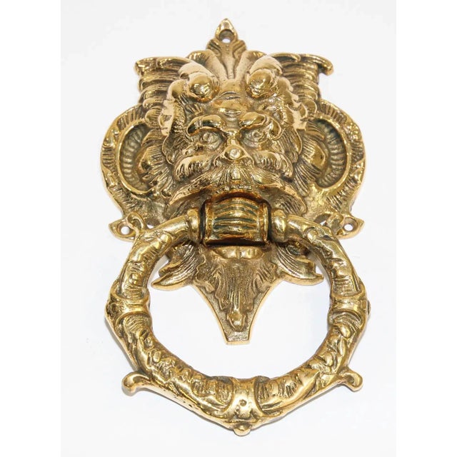 Vintage solid cast brass Italian door knocker with scary evil devil man face. The large mascaron crest has been crafted in...