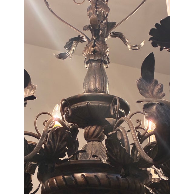 Crafted in the French Provincial style, this large fixture features 8 hand-formed scrolling arms and heart-shaped upper...