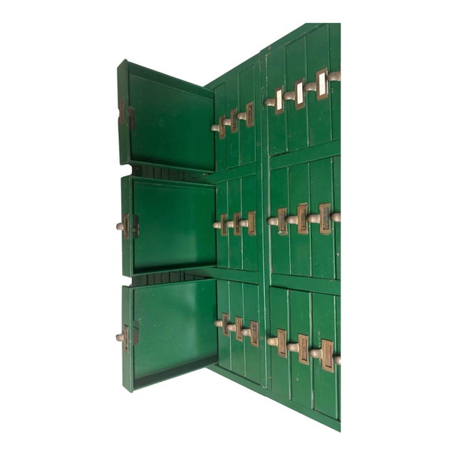 Striking vintage Library Bureau card catalog cabinet in a rich green painted finish with original-style brass label pulls....