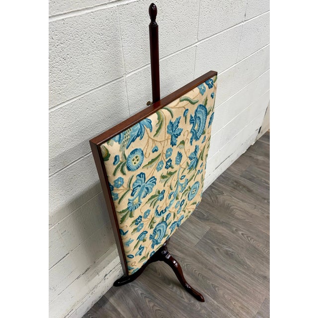 This is a beautiful vintage Queen Anne style adjustable needlepoint embroidered fire screen in solid mahogany. Features a...