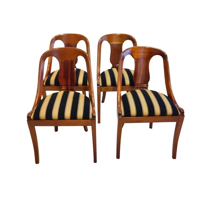 A well-proportioned set of four German Biedermeier gondola chairs dating to around 1820. The chairs show the...