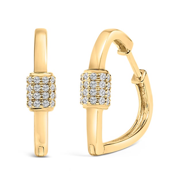 Encircle yourself with the brilliance of sophistication with these huggie hoop earrings, exquisitely molded from lustrous...
