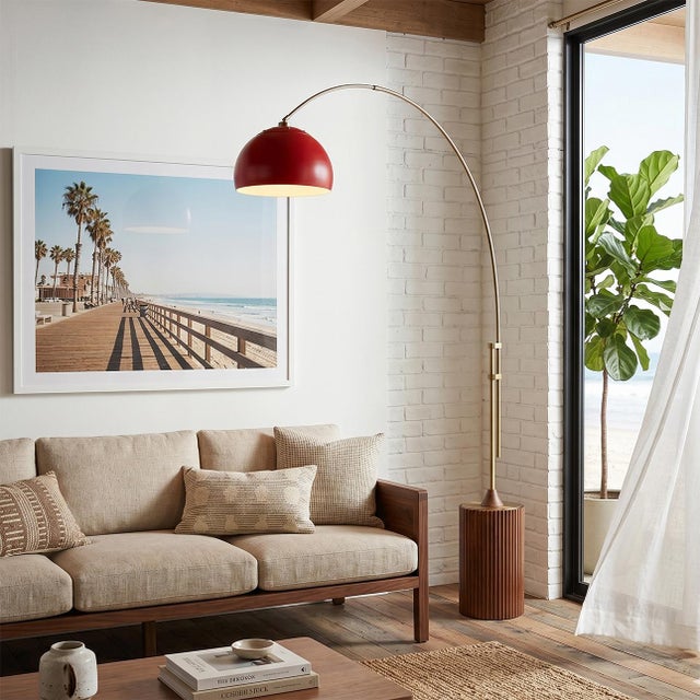 Weathered Brass steel paired with a Dark Walnut wood base defines the Tambo Arc Lamp, a Mid-Century Modern masterpiece...