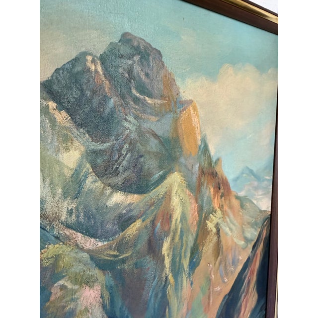 This original 1939 signed mountain landscape oil painting by Robert Corneil depicts a dramatic alpine peak rising above a...