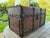 An exceptional 19th-century Victorian period traveling cabin trunk crafted from warm, solid pine wood. This low-profile,...