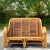 A striking vintage Coastal loveseat. A chic 1950s design made in a tortoise shell pencil reed. Coordinating chair also...