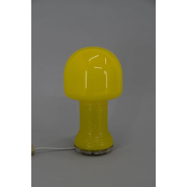 Yellow glass table lamp produced in germany in 1970s. Very good original condition 1 x 60 w, e 25 - e 27 bulb. Us plug...