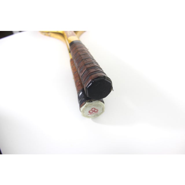 Width: 9 inches Height: 27 inches Depth: 1.5 inches Vintage curated matching set of two wooden tennis racquets for...