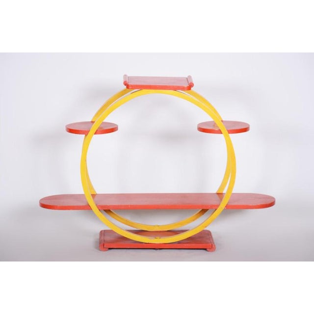 This unconventional plant stand from the 1940s, originating from Czechoslovakia, embodies a fresh, playful, and...