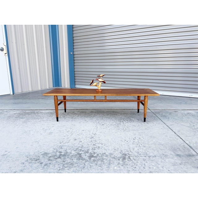Designed by Andre Bus for Lane Furniture's iconic 1959 "Acclaim" series, this mid-century modern surfboard coffee table is...
