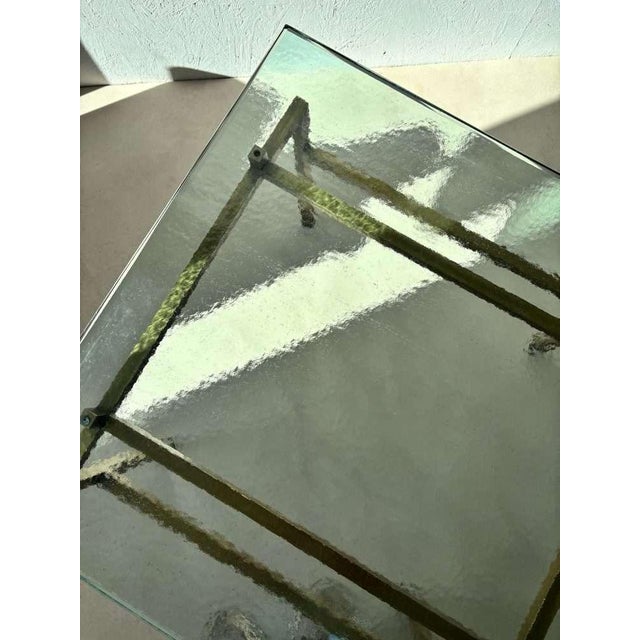 An elegant Swedish coffee table from the 1960s, a stylish interplay of glass and brass. This table combines Scandinavian...