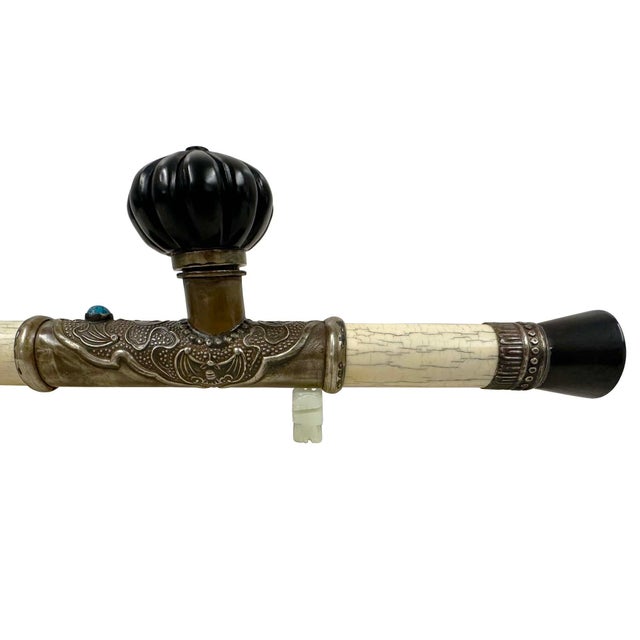 This object is an traditional antique Chinese opium pipe, commonly dated back to the late Qing Dynasty. It features a...