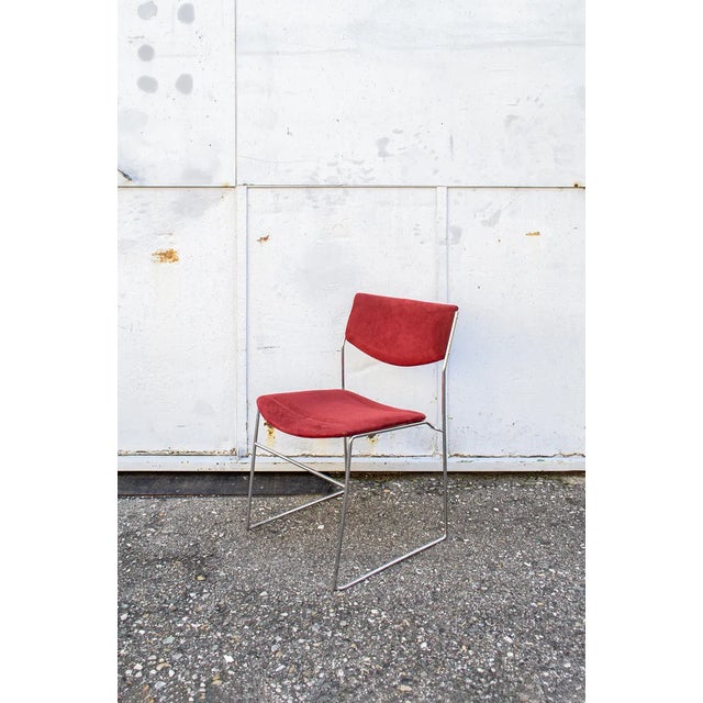 Stackable chairs with chromed steel structure, seat and backrest covered in fabric. Producer Bonomia 70s This piece has an...