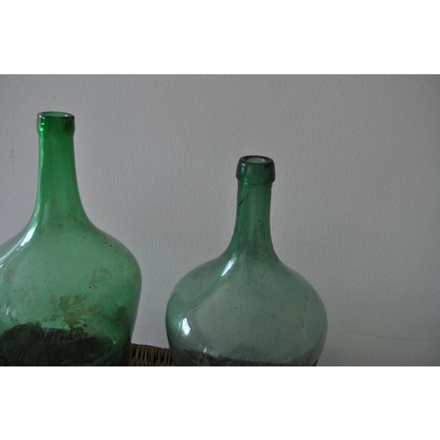 Hungarian wine bottle, pair Color: green Materialsglass Condition good, wear consistent with age and use.