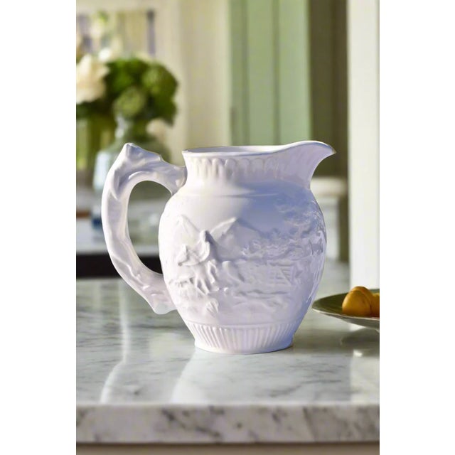 WEDGWOOD CREAMWARE RELIEF DECORATED CREAMER Era: Late 18th/Early 19th Century Origin: Staffordshire, England Material:...