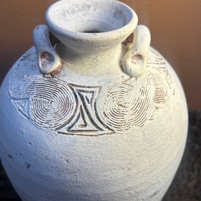 This exceptional vintage amphora-style studio pottery vase brings a beautiful, grounded presence to any space. Hand-...