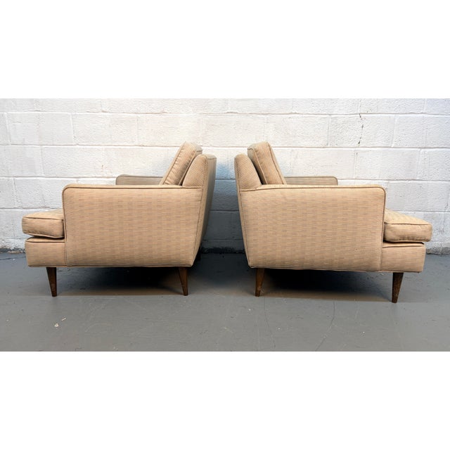 Stylish and comfortable, this pair of mid-century modern slipper lounge chairs brings timeless design and relaxed...