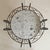 Dating to the 1960s, this French table in hand-forged iron is a study in movement and ornament. The base is composed of...