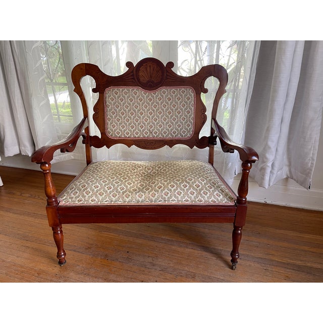 Elegant antique Eastlake Sette and Loveseat matching parlor set. Each has an beautiful shell inlay on the center back....