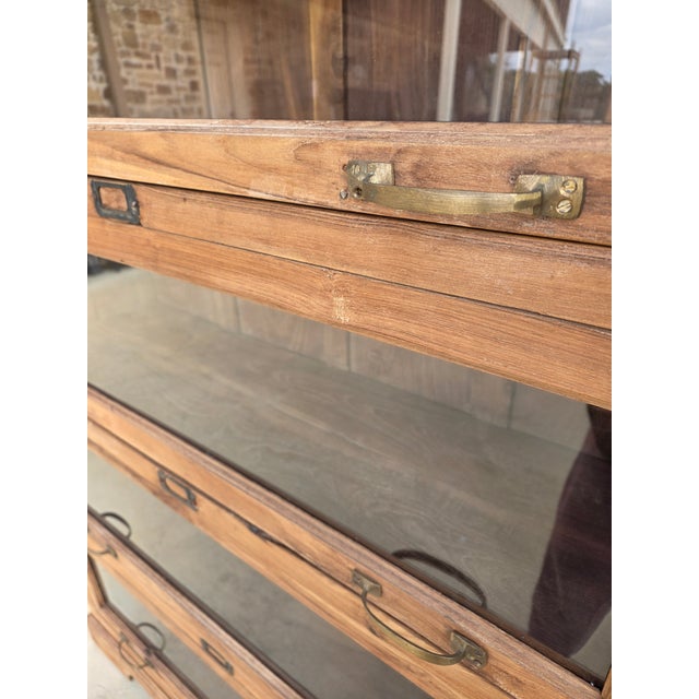 Two are available. Lawyers Bookcase or Barrister Bookcase style cabinet. All one piece and not a stacking Bookcase and Not...