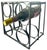 A sculptural mid-20th-century iron wine rack featuring a striking arrangement of intersecting circular forms within a...