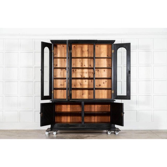 Circa 1880 large 19thc english ebonised oak glazed bookcase together w163 x d52 x h224 cm base w162.5 x d52 x h74.5 cm...
