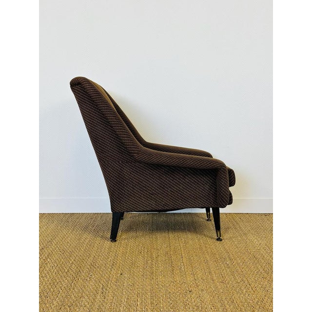 Magnificent vintage armchair from the 1960s with a simple and comfortable design, typical of the french modernist period....