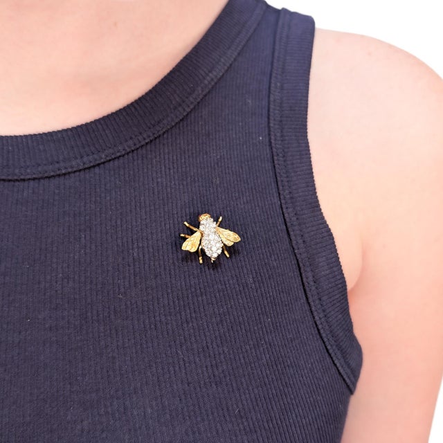 A fine vintage gold, diamond, and ruby bee brooch or pin. In the style of Herbert Rosenthal. In 18 karat yellow gold with...