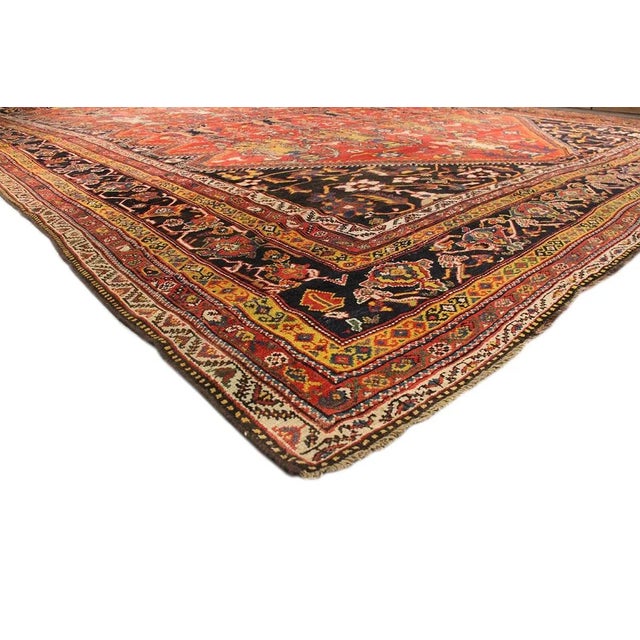 An antique, hand-knotted Bakhtiari rug with a geometric medallion motif on a rust field. This gorgeous rug has magnificent...