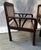 Great pair of Deco-period British colonial hand-caned teakwood club chairs. Recently restored and recaned. Ready for...