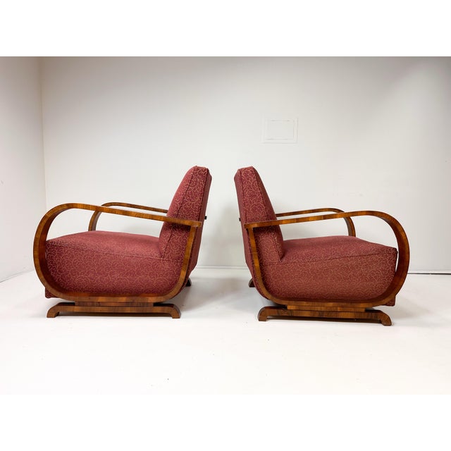 Pair of Art Deco Swedish Lounge chairs. Bentwood chairs veneered in figural Burl wood. Spring seat cushions. Circa 1930's