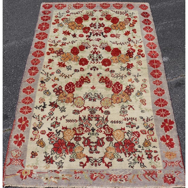 Textile Vintage Turkish Oushak Rug in All-Over Flower Design Background & Simple Boteh Border For Sale - Image 7 of 13