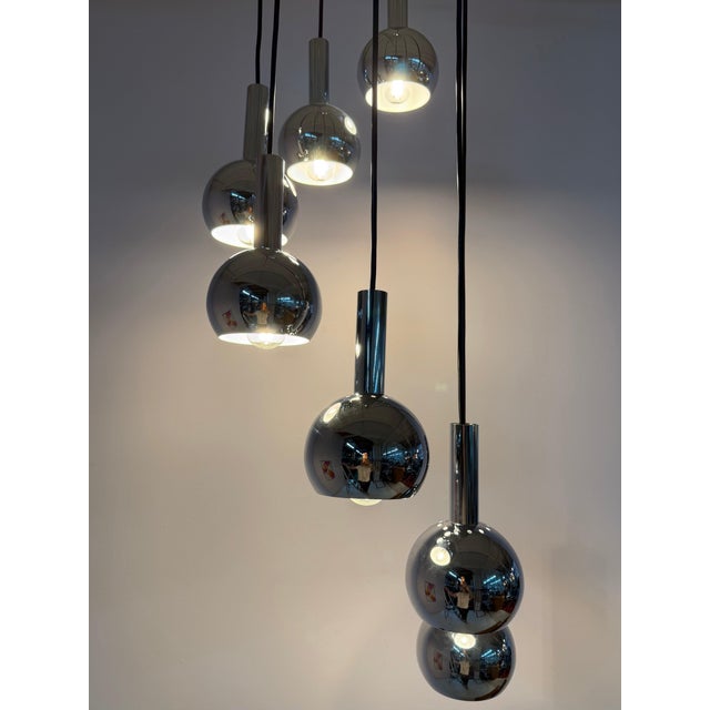 An impressive statement of space-age design: This 7-light cascade lamp by renowned manufacturer Richard Essig brings the...
