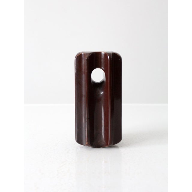This is a large vintage ceramic guy strain electric insulator, featuring a rich brown glaze and a classic design with...