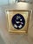 Jewelry from the 1950-60s had been mounted in a frame for display. It appears to be a small rose pin, a set of rhinestone...