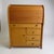 A classic vintage oak roll-top bureau desk, offering practical storage and timeless appeal. Featuring a smoothly operating...