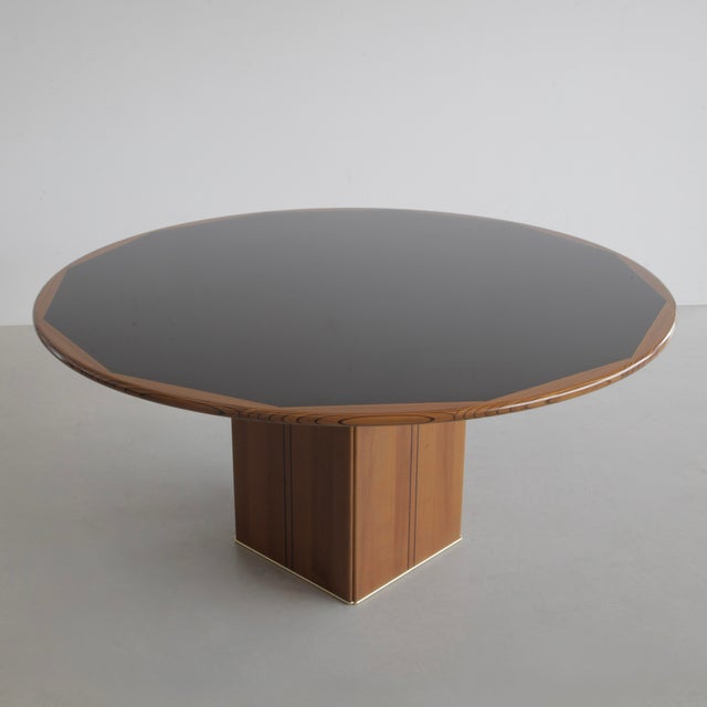Large round table with black inlay, solid wooden edges with walnut inlays. These edges became iconic for this series of...