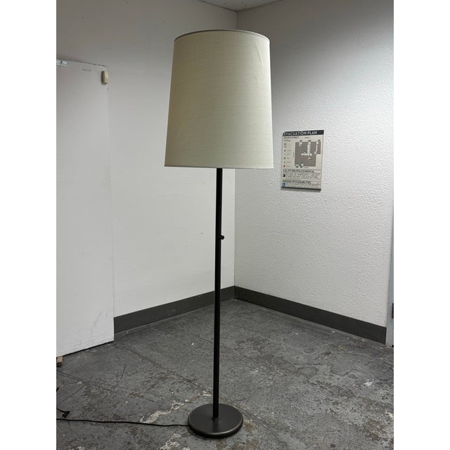 Design Plus Gallery presents a Buster Floor Lamp by Rico Espinet from Robert Abbey. This modern floor lamp has a tall,...