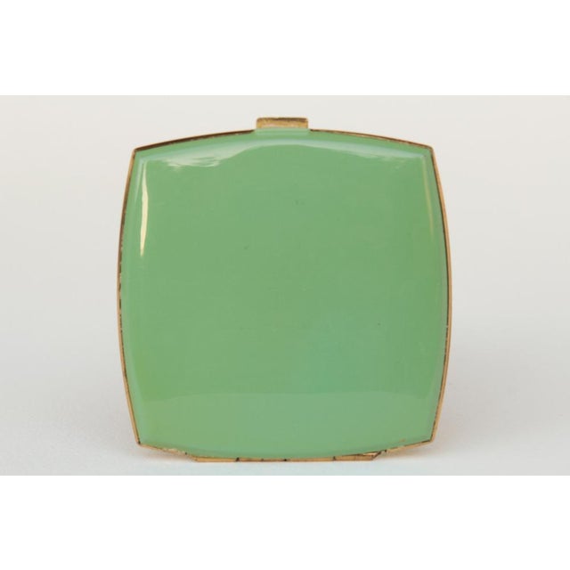 Beautiful, finely crafted Art Deco powder compact, made in Germany in the 1930s. Made of tombac, with a lime green coating...