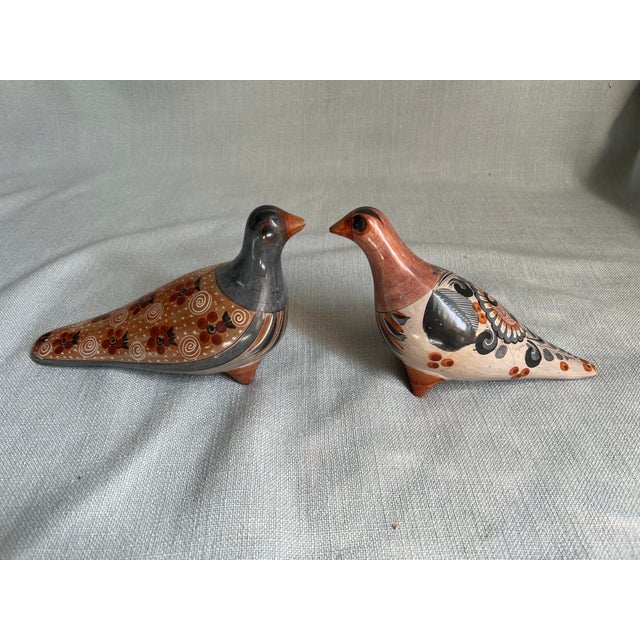 Pair of vintage Mexican Tonala folk art hand painted clay bird pidgeons with orange eyes. Larger pidgeon measures...