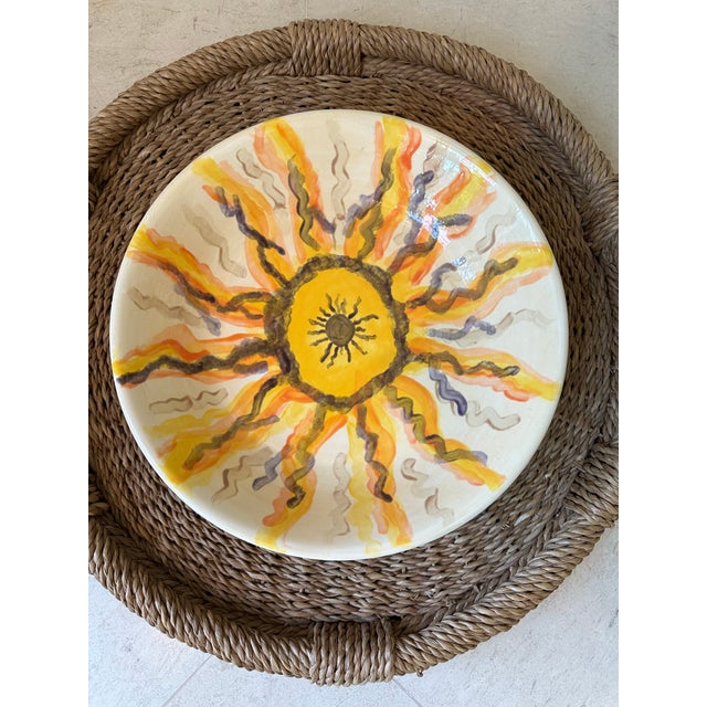 Terrific 12.5” Ceramic Pottery Bowl featuring a HandPainted Sunburst. Charming sunburst of warm shades fills the interior...