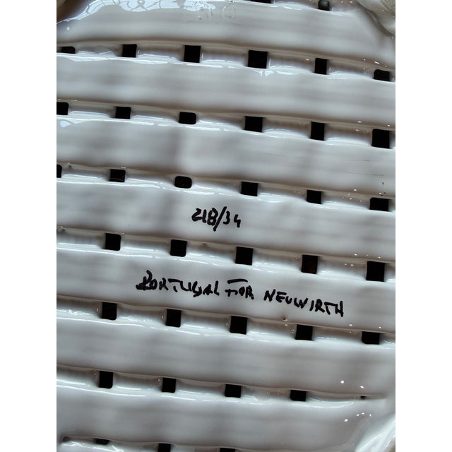 Elegant vintage white glazed ceramic basket by Neuwirth, made in Portugal, featuring a beautifully sculpted open...