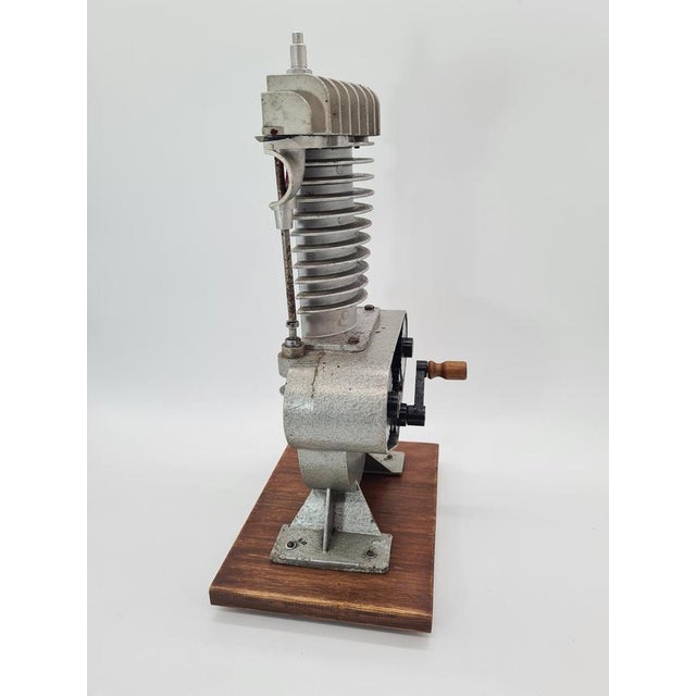 An authentic technical model of an engine/piston mechanism, made as a training or demonstration exhibit, now serving as a...
