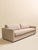 This 1970s sofa features a long, low silhouette with clean arms, a single bench cushion, and two coordinating round...