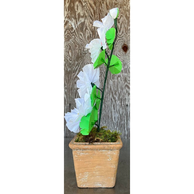 Contemporary hand-rolled paper flowers are a modern, artistic take on traditional floral arrangements. These flowers are...