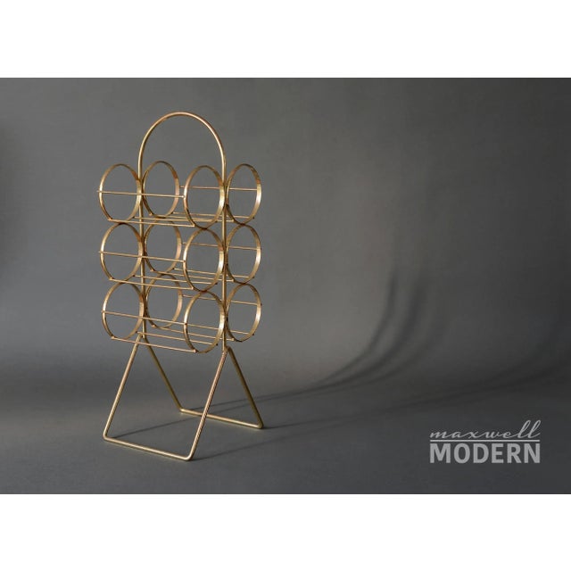 Here's one wine rack with a very unique design you've never seen before! Made of brass, holds 6 bottles and stands on a...