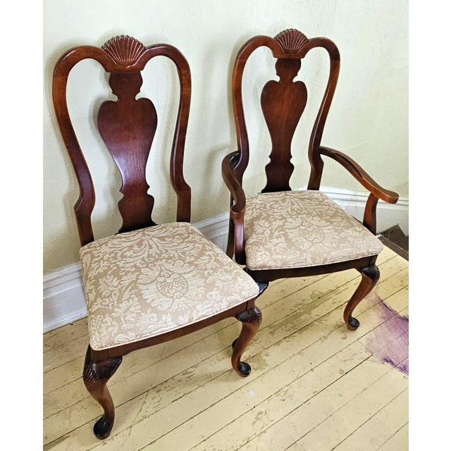 A gorgeous 1980 set of four Queen Anne style dining chairs in solid, warm-tone cherry. The set includes two captain...