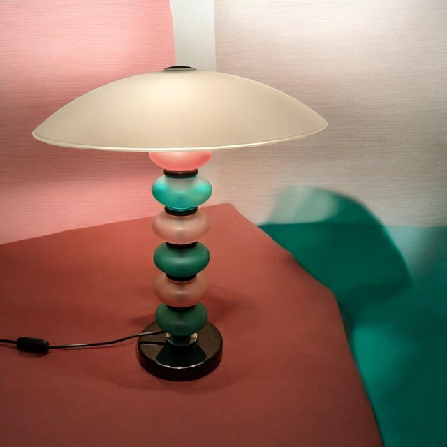 Floor lamp made in Murano in the Cenedese style with a black base and rings in glass paste. Multicolored blown satin glass...