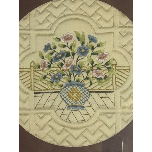 This is a Gold Bamboo type framed and matted 16” Asian Embroidery of Flowers/Vase.